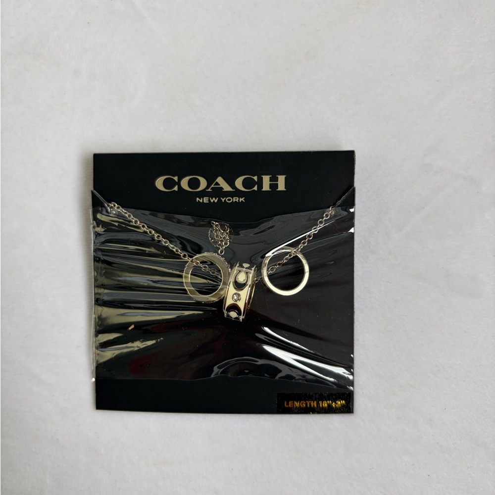 Coach Silver-Tone Layered Necklace with Ring and Cylinder Charms
